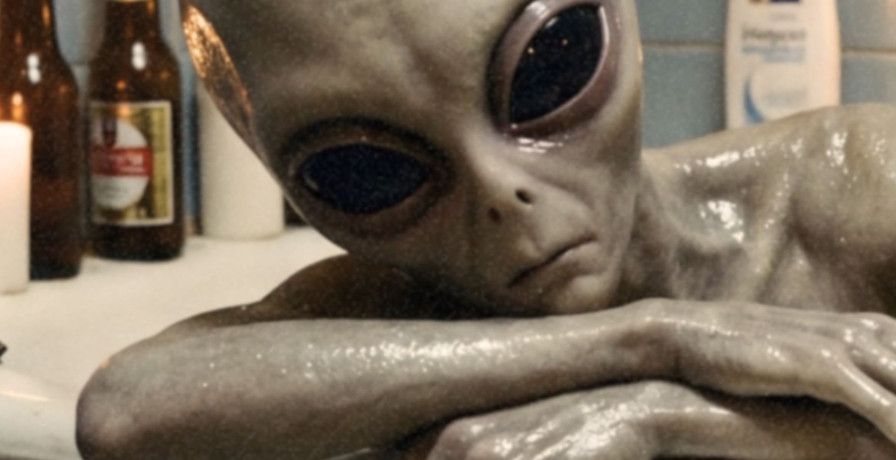 Intense warm-toned close-up of a grey alien's large black eyes and long fingers draped over the rim of a worn bathtub, candlelight flickering across peeling blue tiles and beer bottles behind – unframed retro alien portrait poster, ufoposter.com