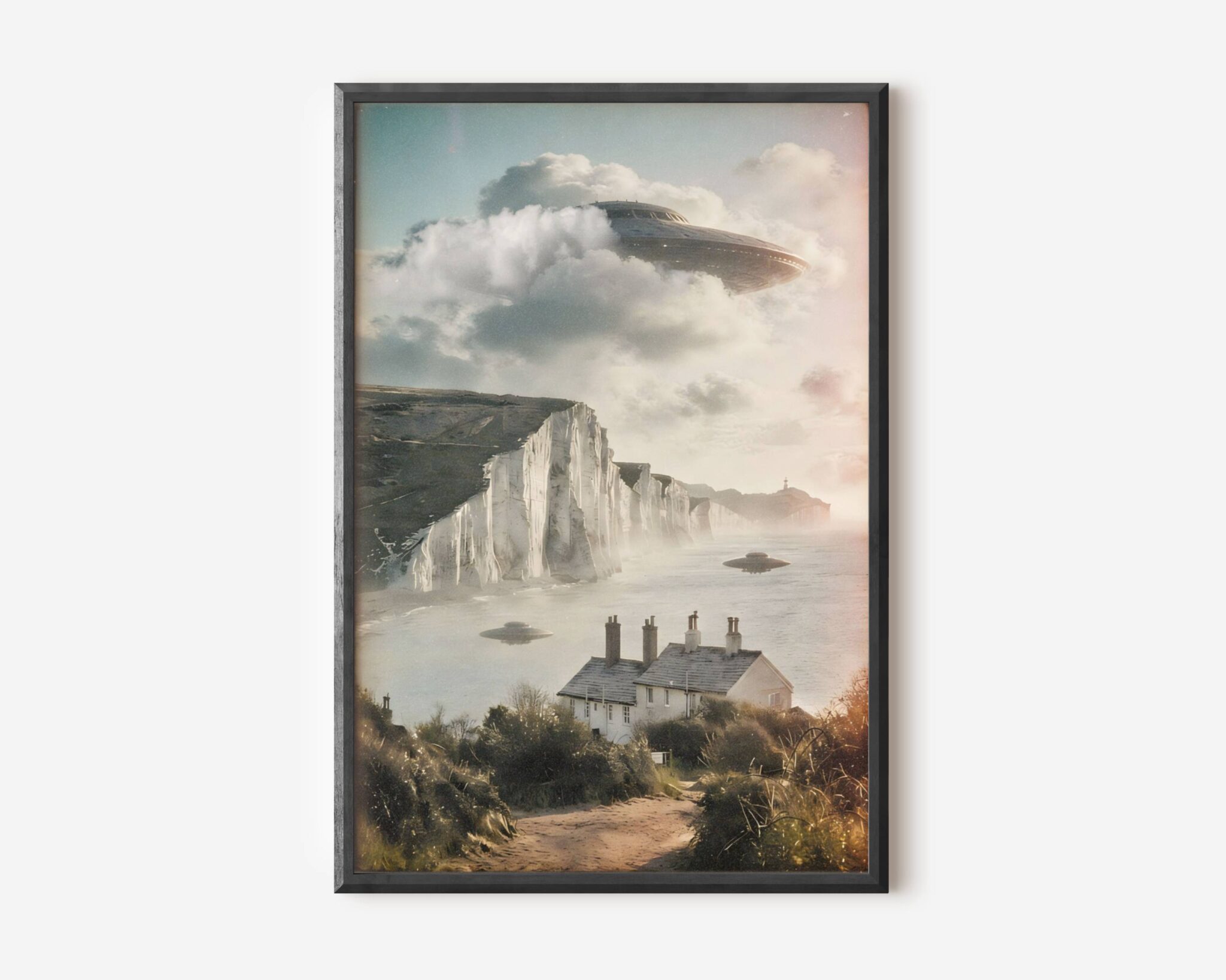 Premium retro sci-fi poster of a giant UFO breaking through clouds above the Seven Sisters chalk cliffs in East Sussex, with smaller craft drifting over the sea and English cottages sitting quietly in the foreground – unframed alien art poster, ufoposter.com