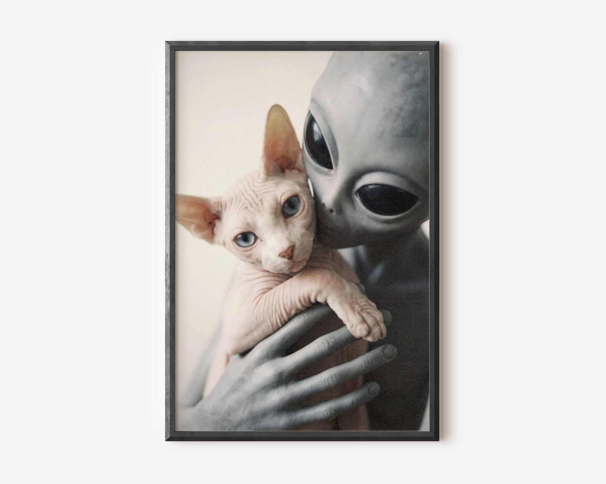 Premium retro sci-fi poster of a grey alien cradling a blue-eyed sphynx kitten in long slender fingers, warm-toned and intimate – the perfect funny alien wall art print for cat lovers and sci-fi fans alike – unframed alien cat poster, ufoposter.com