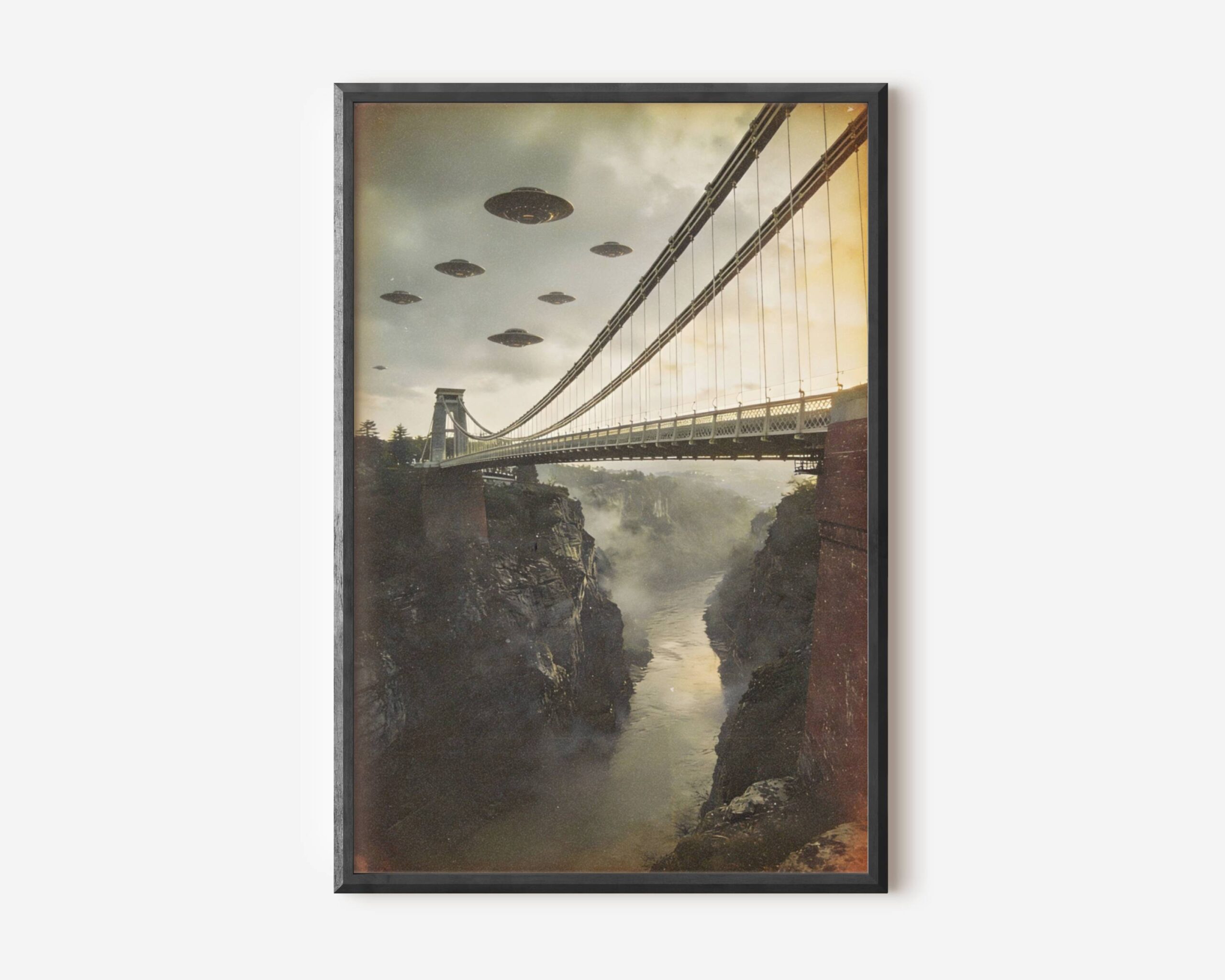 Premium retro sci-fi poster of a formation of UFOs hovering in dramatic golden skies above the Clifton Suspension Bridge in Bristol, the misty Avon Gorge cutting deep through rocky cliffs below – unframed alien art poster, ufoposter.com