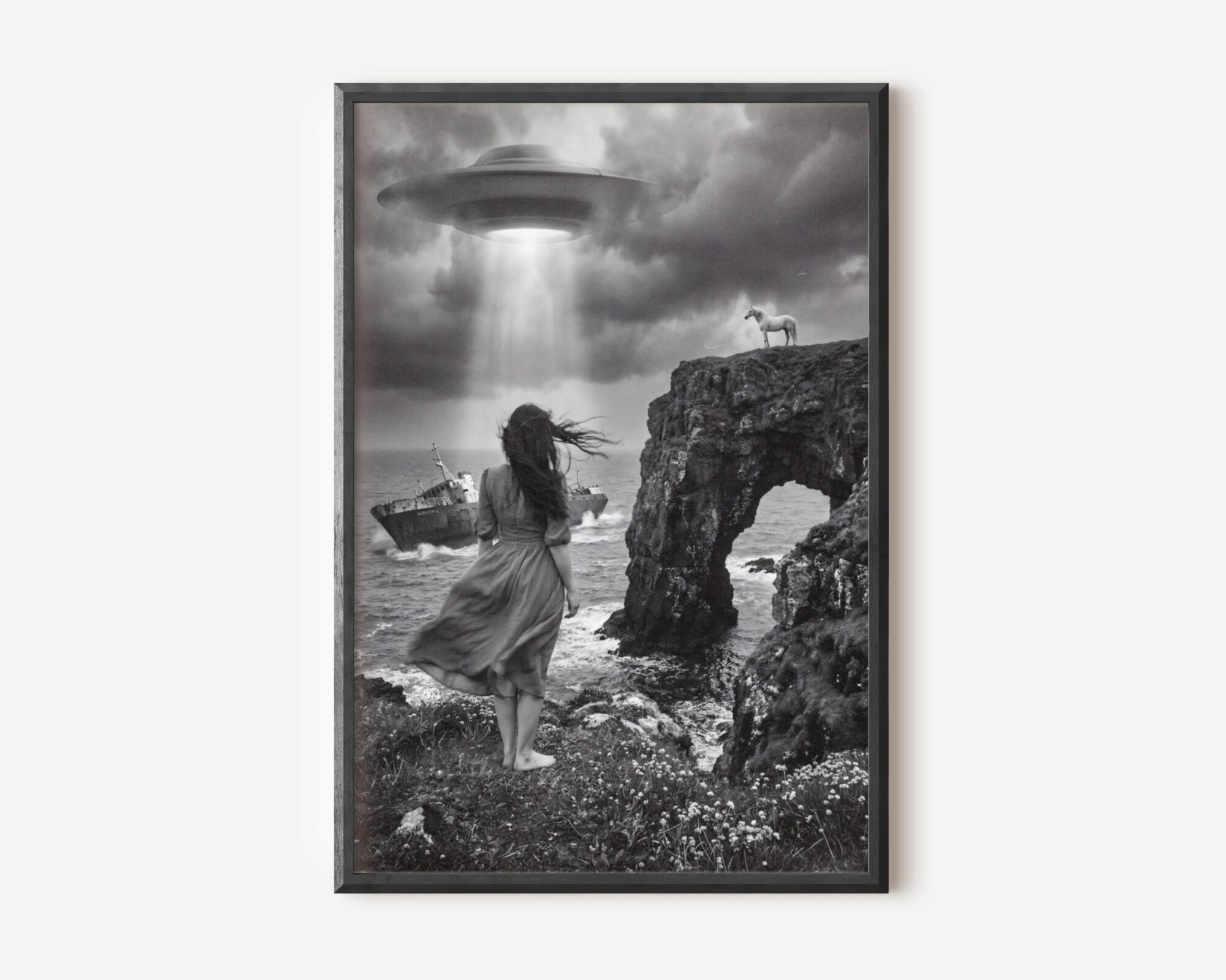 Premium dark surreal black and white poster of a windswept barefoot woman walking along a dramatic rocky coastline toward a shipwreck, a glowing UFO beam breaking through heavy storm clouds and a unicorn perched on a clifftop rock arch — hauntingly beautiful dark surreal wall art – unframed dark surreal art poster, ufoposter.com