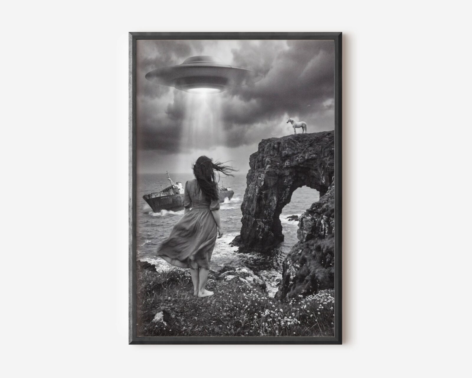 Premium dark surreal black and white poster of a windswept barefoot woman walking along a dramatic rocky coastline toward a shipwreck, a glowing UFO beam breaking through heavy storm clouds and a unicorn perched on a clifftop rock arch — hauntingly beautiful dark surreal wall art – unframed dark surreal art poster, ufoposter.com