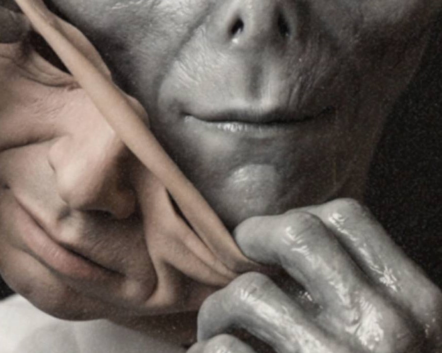 Intense close-up dark portrait of a grey alien in a business shirt and tie carefully peeling away a human mask, exposing the face beneath – unframed dark alien portrait poster, ufoposter.com