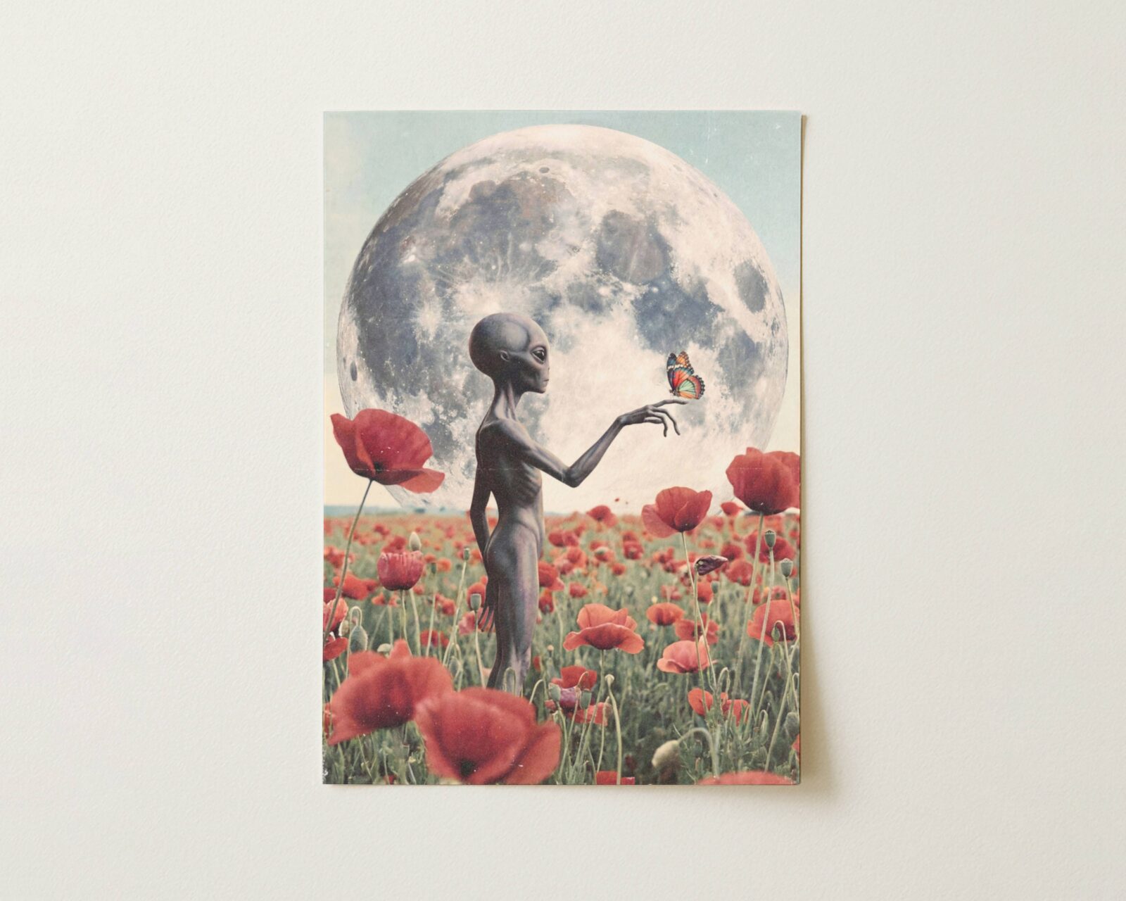 Flat print dreamy retro artwork of a grey alien standing in a red poppy field beneath a huge full moon, a butterfly resting on one extended finger in soft cinematic light — high quality unframed flat poster print, ufoposter.com