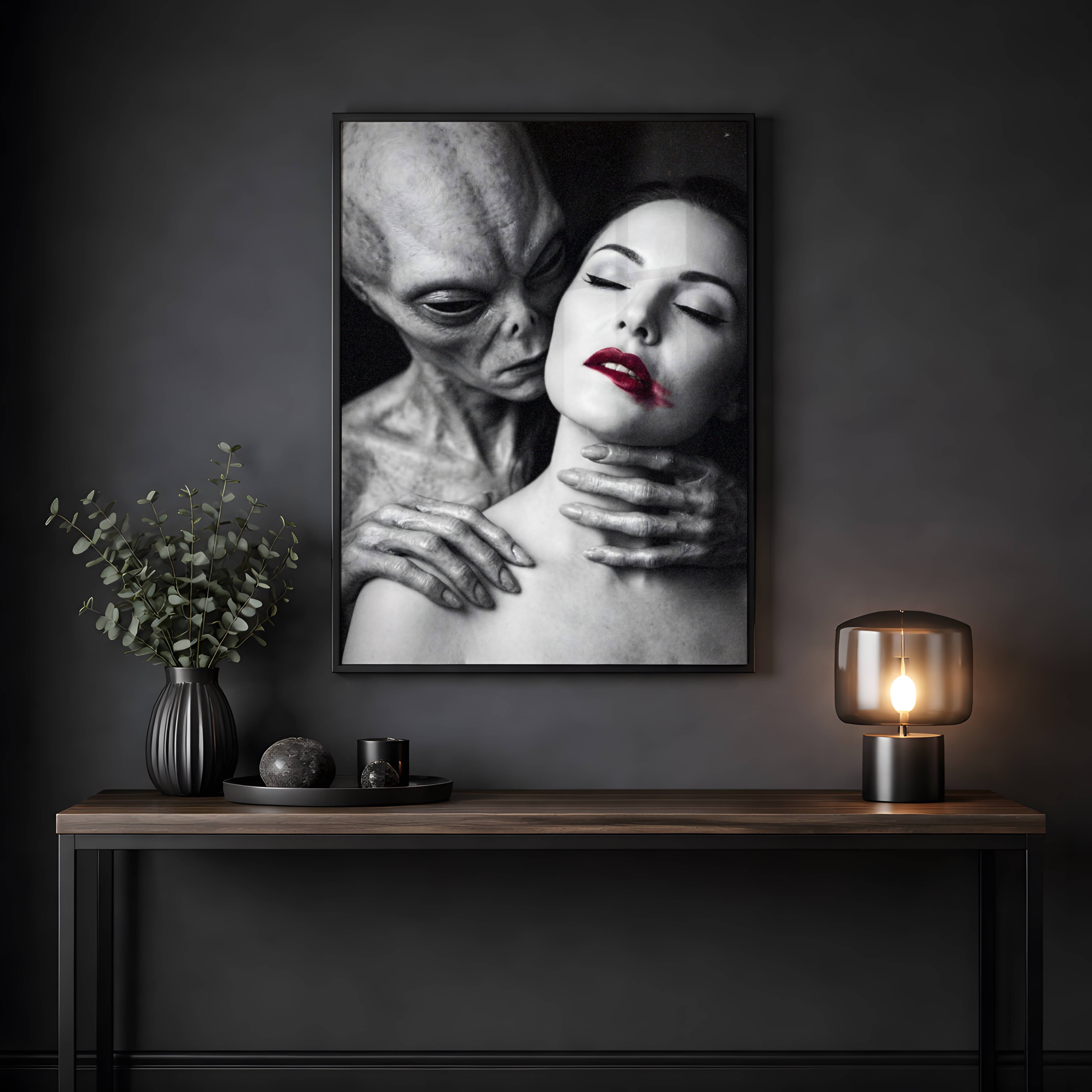 Striking black and white artwork of a grey alien holding a woman intimately from behind, her red lips the sole accent of color in this dark and cinematic sci-fi portrait – unframed dark alien wall poster, ufoposter.com