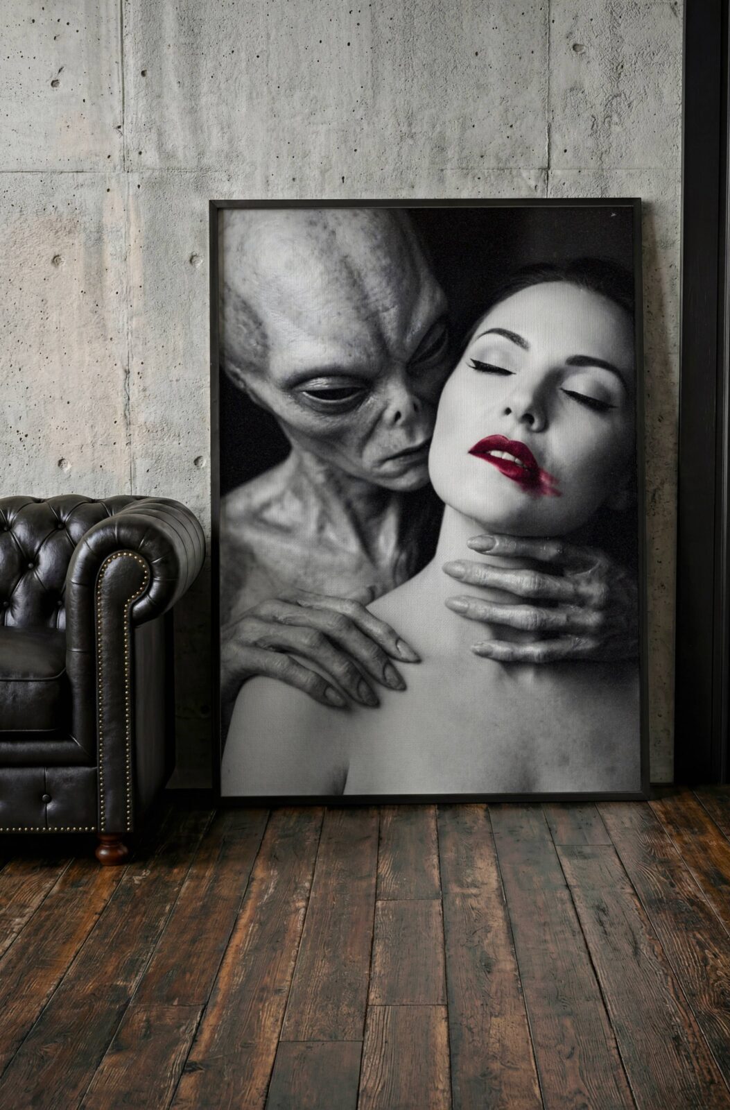 Black and white flat print artwork of a grey alien embracing a woman with red lips in a dark intimate portrait – high quality unframed flat poster print, ufoposter.com