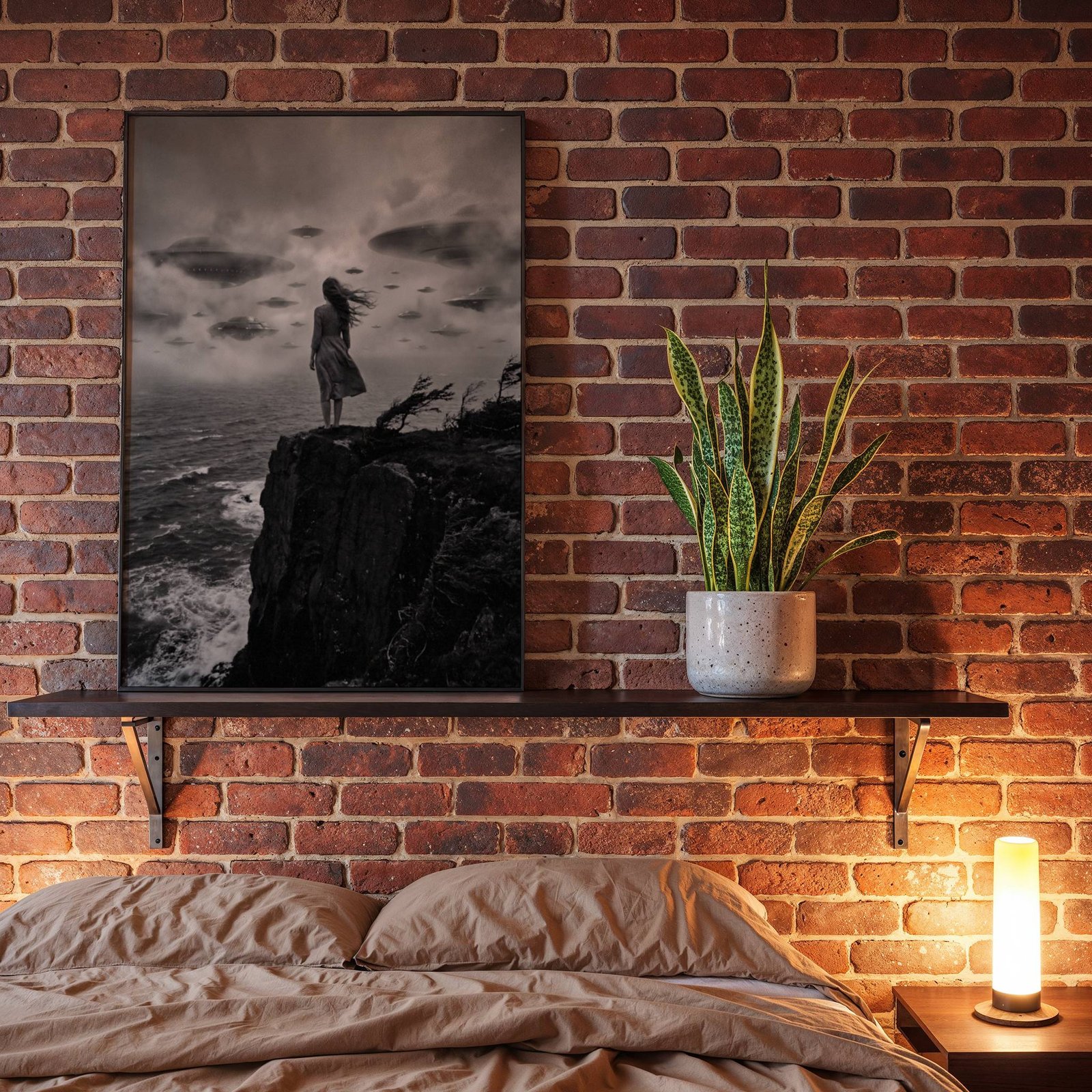 Black and white UFO art print displayed above a bed in a moody, dimly lit bedroom. The dramatic image of a woman with windswept hair standing before a fleet of hovering flying saucers adds an atmospheric, cinematic quality to the sleeping space.