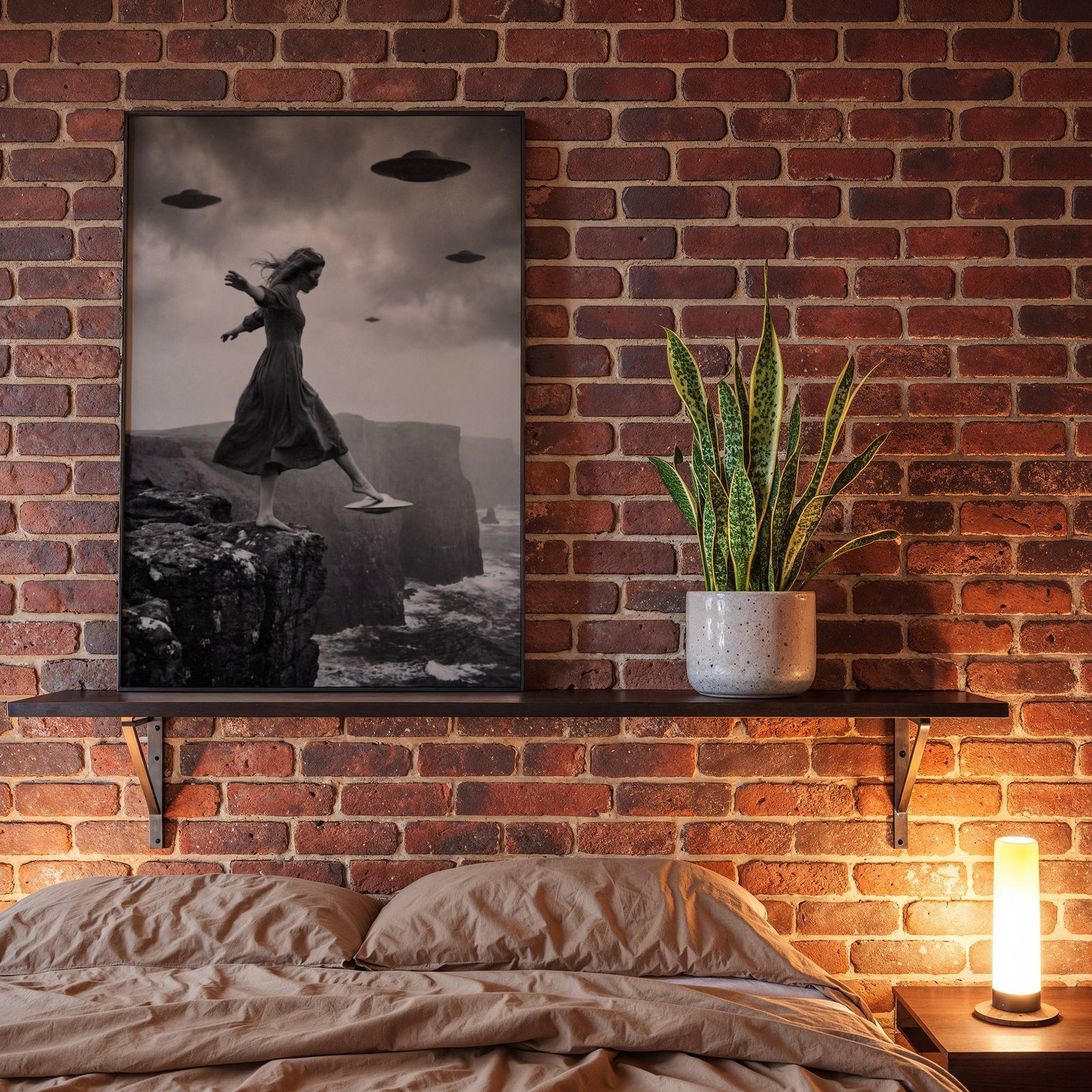 Black and white fine art poster of a woman in a flowing dress stepping off a dramatic rocky cliff onto a hovering UFO as flying saucers circle above a wild stormy coastline, displayed in a bedroom as a striking and atmospheric piece of wall decoration.