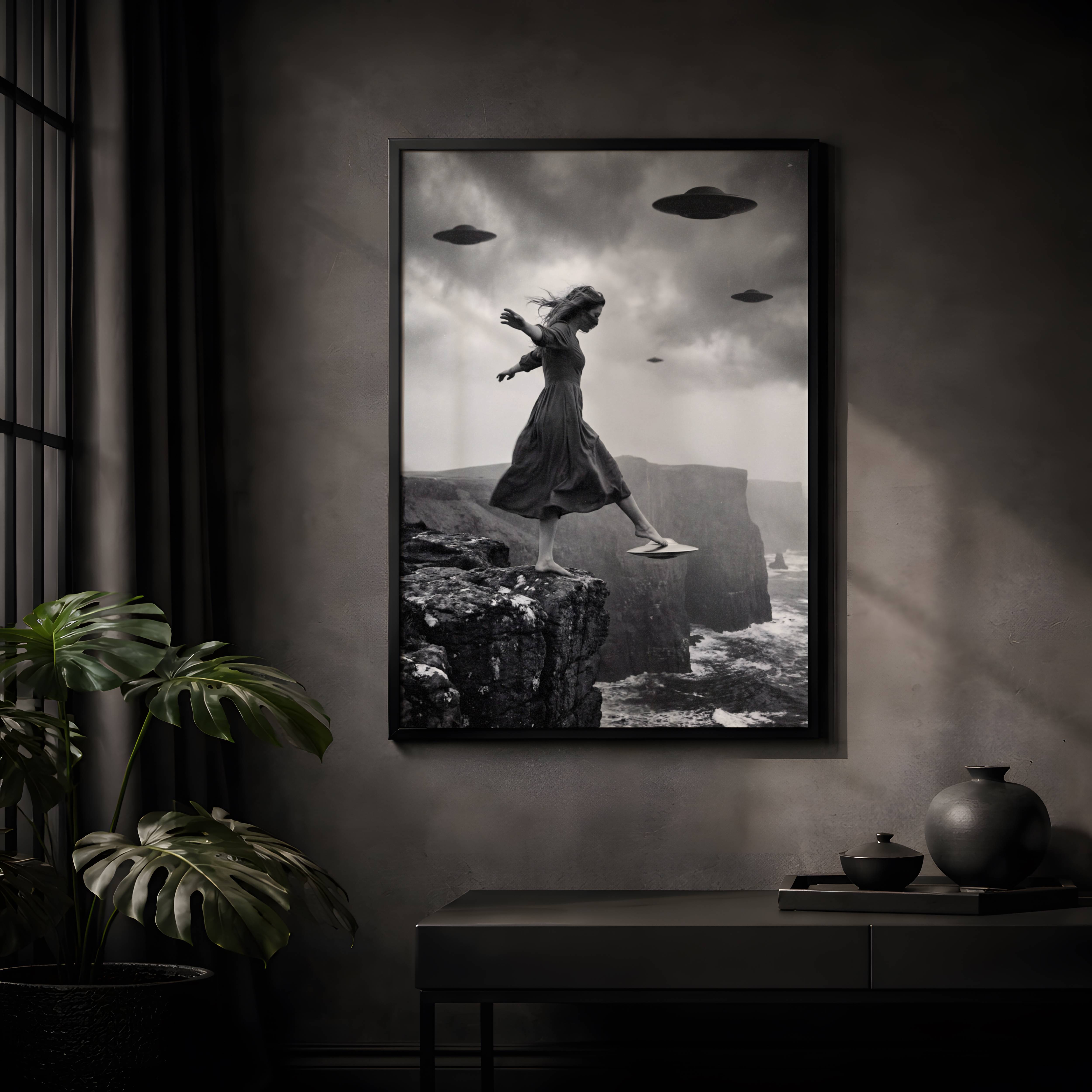 Striking black and white surreal artwork of a windswept woman walking off a coastal cliff with multiple spacecraft looming in a dramatic overcast sky – unframed dark alien wall poster, ufoposter.com