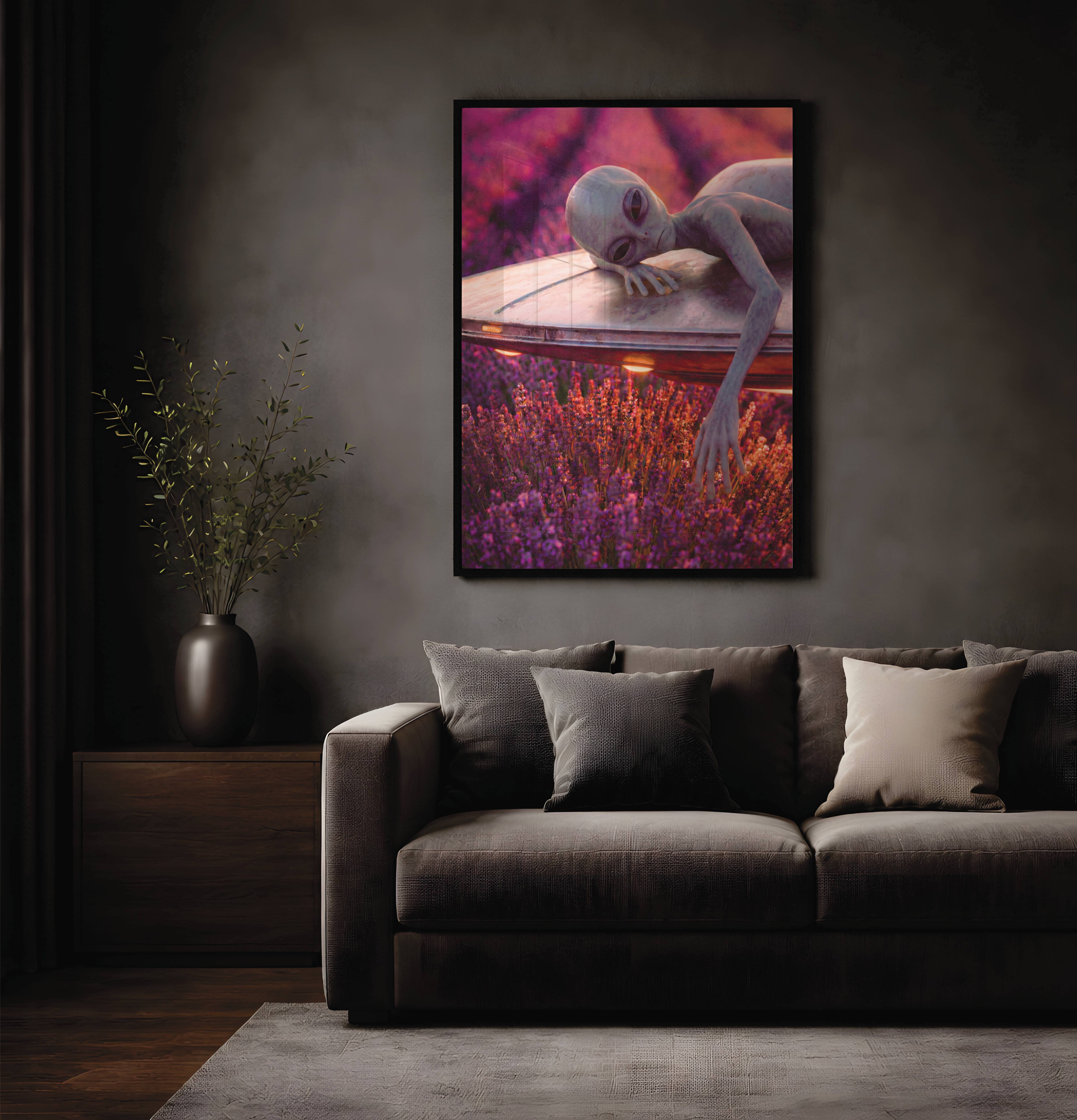 Rich purple and golden warm retro portrait of a grey alien lying contentedly across his UFO above a glowing lavender field — a dreamy and distinctive alien wall art print perfect for living room decor – unframed retro alien wall poster for living room, ufoposter.com