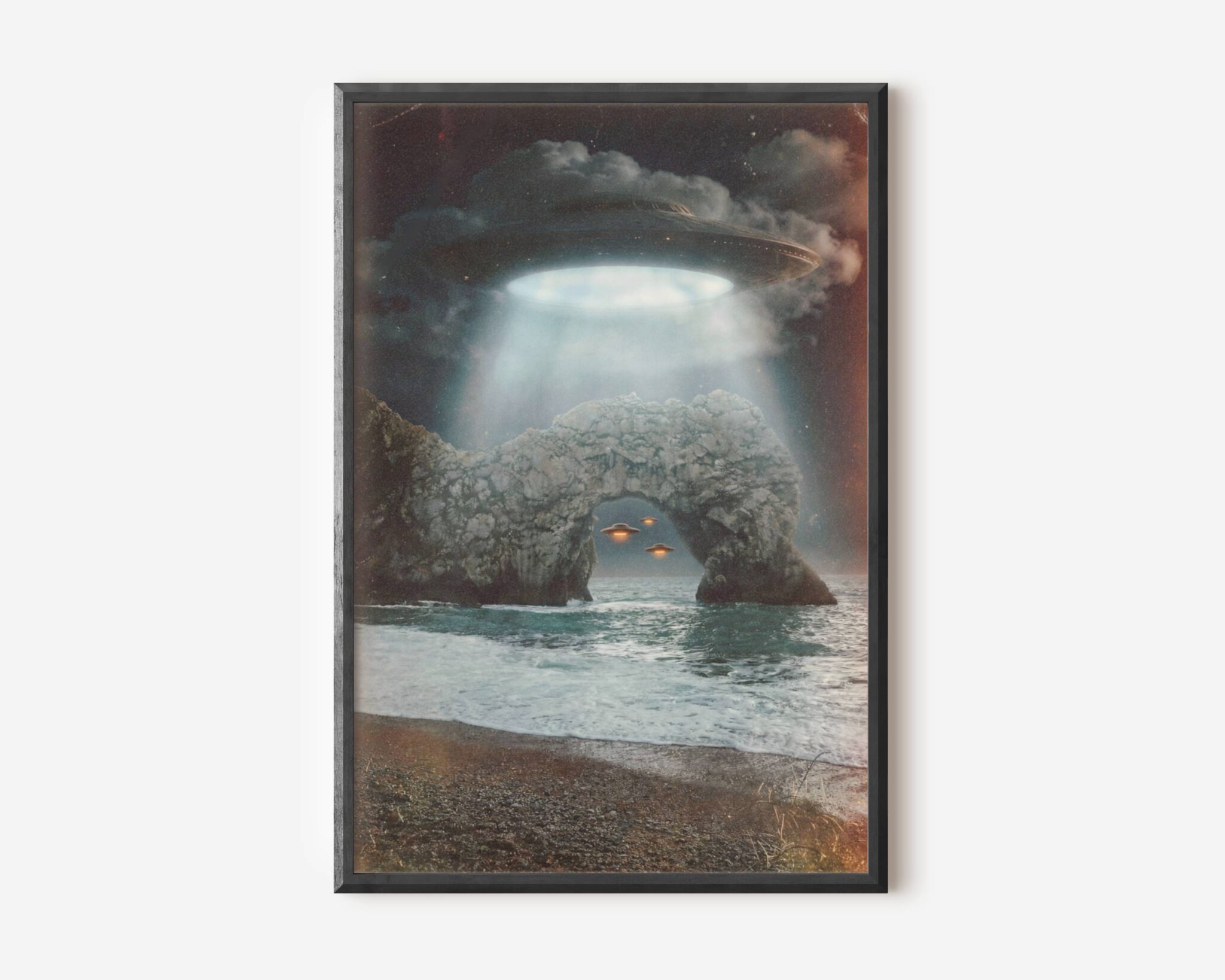 Premium dark retro sci-fi poster of a massive UFO hovering above the iconic Durdle Door limestone arch on the Dorset coast, blinding blue-white beam pouring through storm clouds and two amber-glowing spacecraft drifting through the arch over a churning sea — dramatically atmospheric and uniquely British UFO wall art – unframed retro Durdle Door alien art poster, ufoposter.com