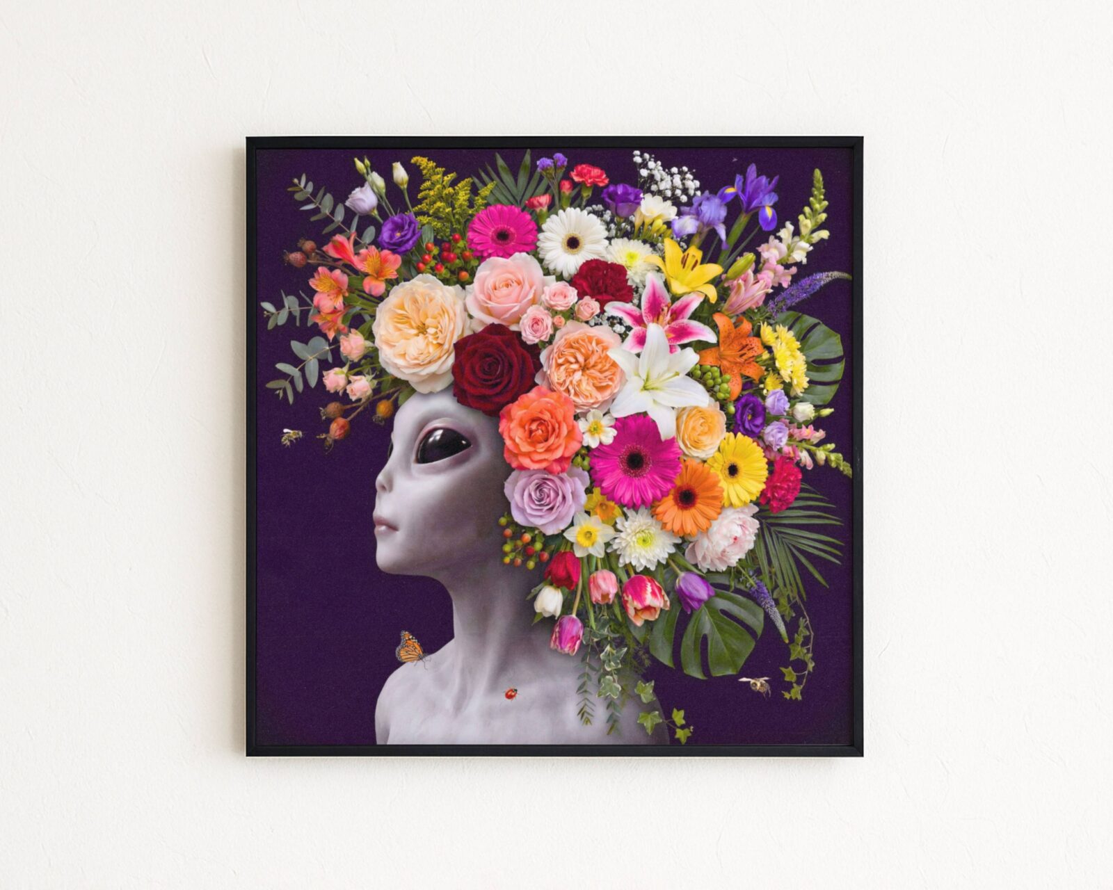 Premium bold surreal portrait of a grey alien with calm dark eyes crowned with an extraordinary abundance of flowers — roses, gerberas, lilies, irises, tulips, snapdragons, lisianthus, baby's breath and monstera leaves — cascading against deep dark purple with a monarch butterfly and ladybird on her collarbone — a genuinely unique and radiant alien flower wall art print – unframed rich alien flower art poster, ufoposter.com