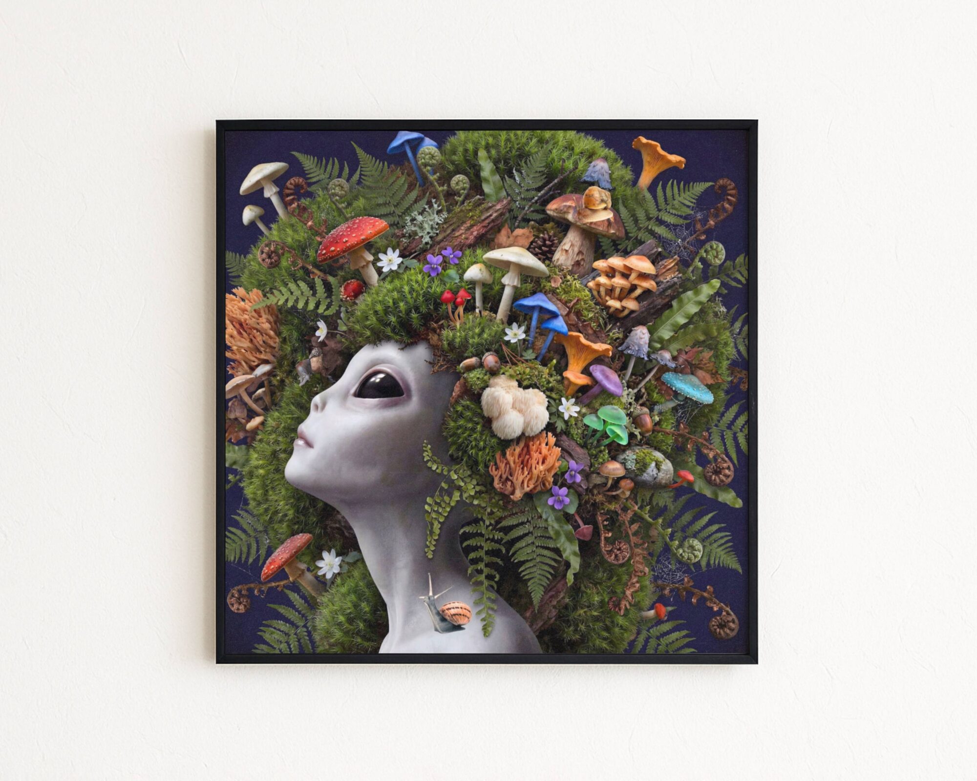 Premium bold surreal portrait of a grey alien with calm dark eyes crowned with an extraordinary abundance of wild mushrooms — fly agarics, chanterelles, lion's mane, porcini, blue trumpets, honey mushrooms and coral fungi — nestled amongst deep green moss, curling ferns, pine cones and woodland flowers against deep dark navy with a snail on her collarbone — a genuinely unique and luscious alien mushroom wall art print – unframed rich alien mushroom art poster, ufoposter.com