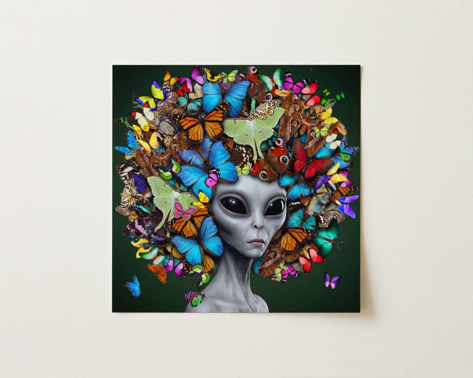 Flat print bold vibrant surreal portrait of a grey alien crowned with an extraordinary explosion of colourful butterflies in every species against a deep forest green background — high quality unframed flat poster print, ufoposter.com