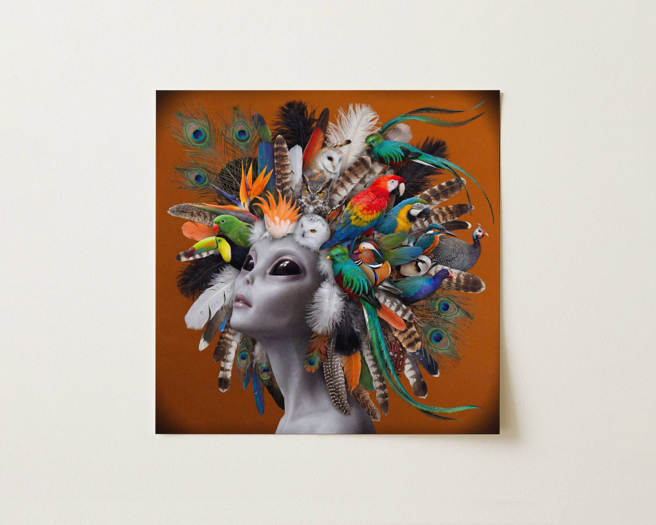 Flat print bold vibrant surreal portrait of a grey alien crowned with an extraordinary gathering of exotic birds — scarlet macaw, toucan, barn owl and quetzal — peacock feathers and tropical plumage cascading against a warm burnt orange background — high quality unframed flat poster print, ufoposter.com