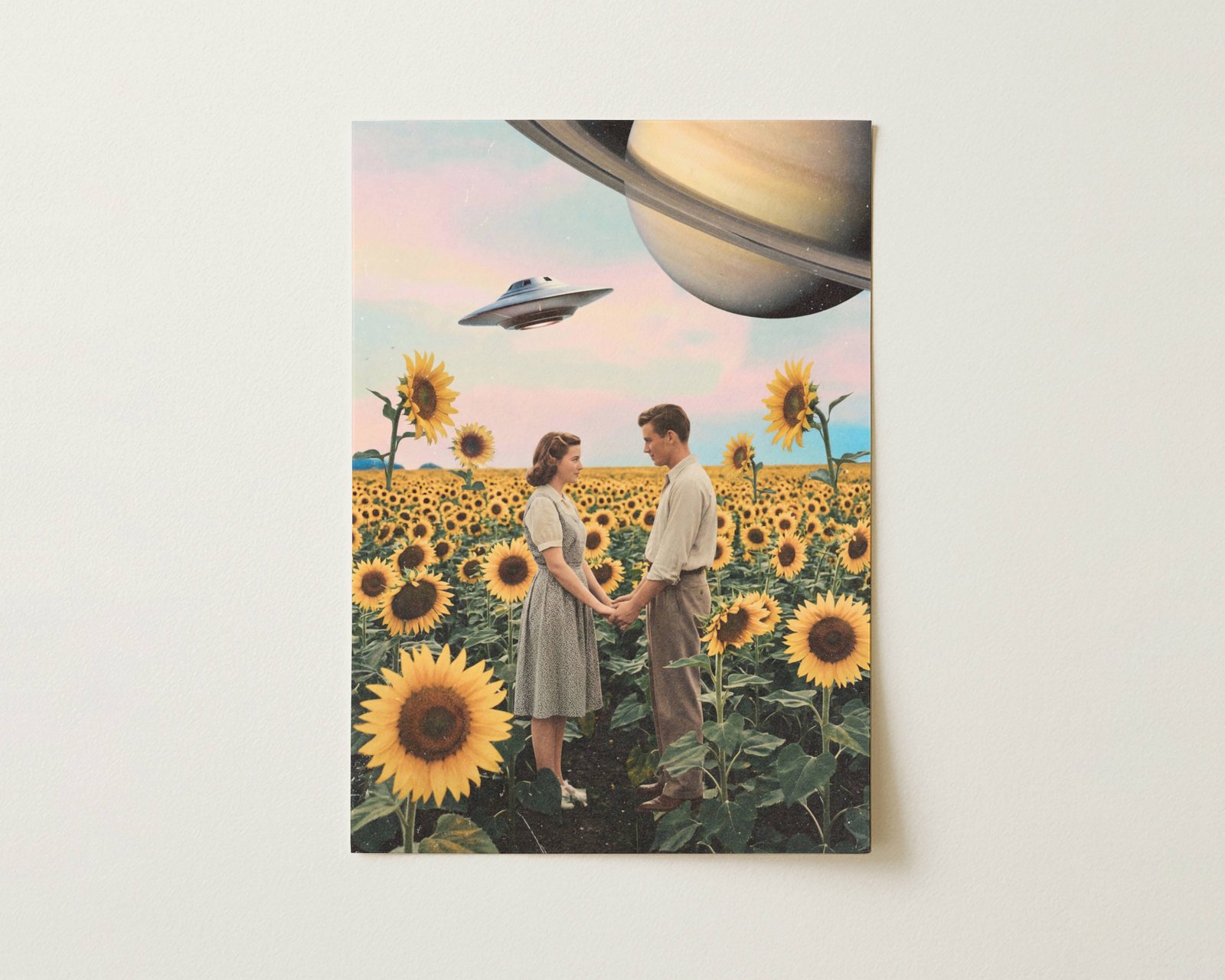 Flat print warm pastel vintage retro collage of a 1950s couple holding hands in a sunflower field beneath a pink sky with Saturn in the corner and a UFO passing overhead — high quality unframed flat poster print, ufoposter.com
