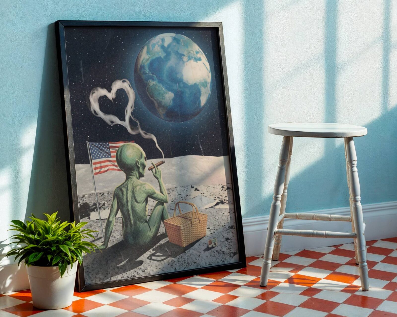 Dark retro collage of a green alien on the lunar surface with a cigar sending heart-shaped smoke into the black sky, an American flag planted in the dust and a picnic basket beside him as a glowing blue Earth fills the background – unframed funny sci-fi moon collage art poster, ufoposter.com