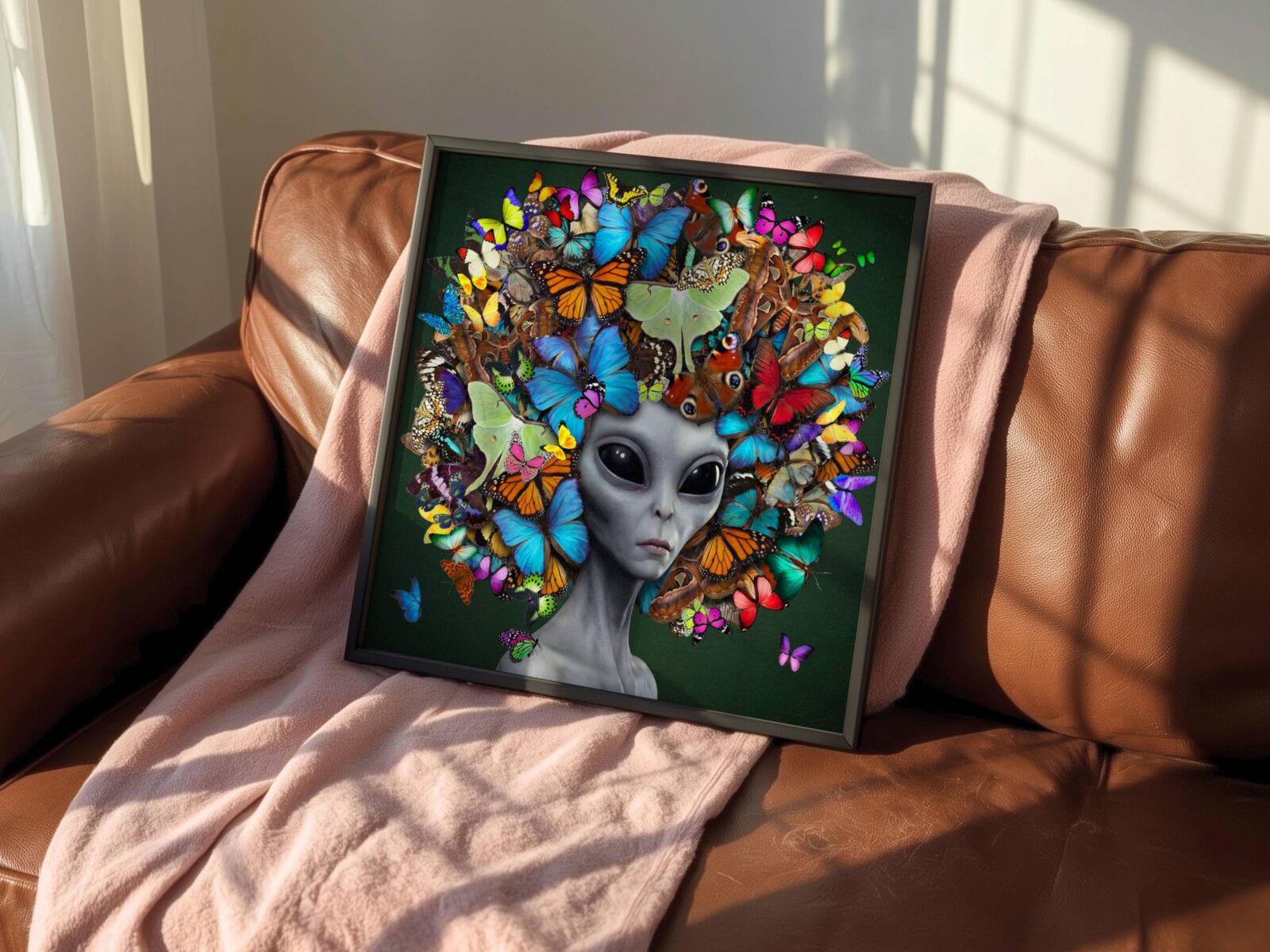 Vibrant surreal portrait of a grey alien with calm dark eyes wearing a breathtaking crown of layered colourful butterflies — monarchs, morphos, luna moths and peacock wings in blue, orange, green and pink — a bold and distinctive colourful living room wall art print – unframed vibrant alien living room poster, ufoposter.com