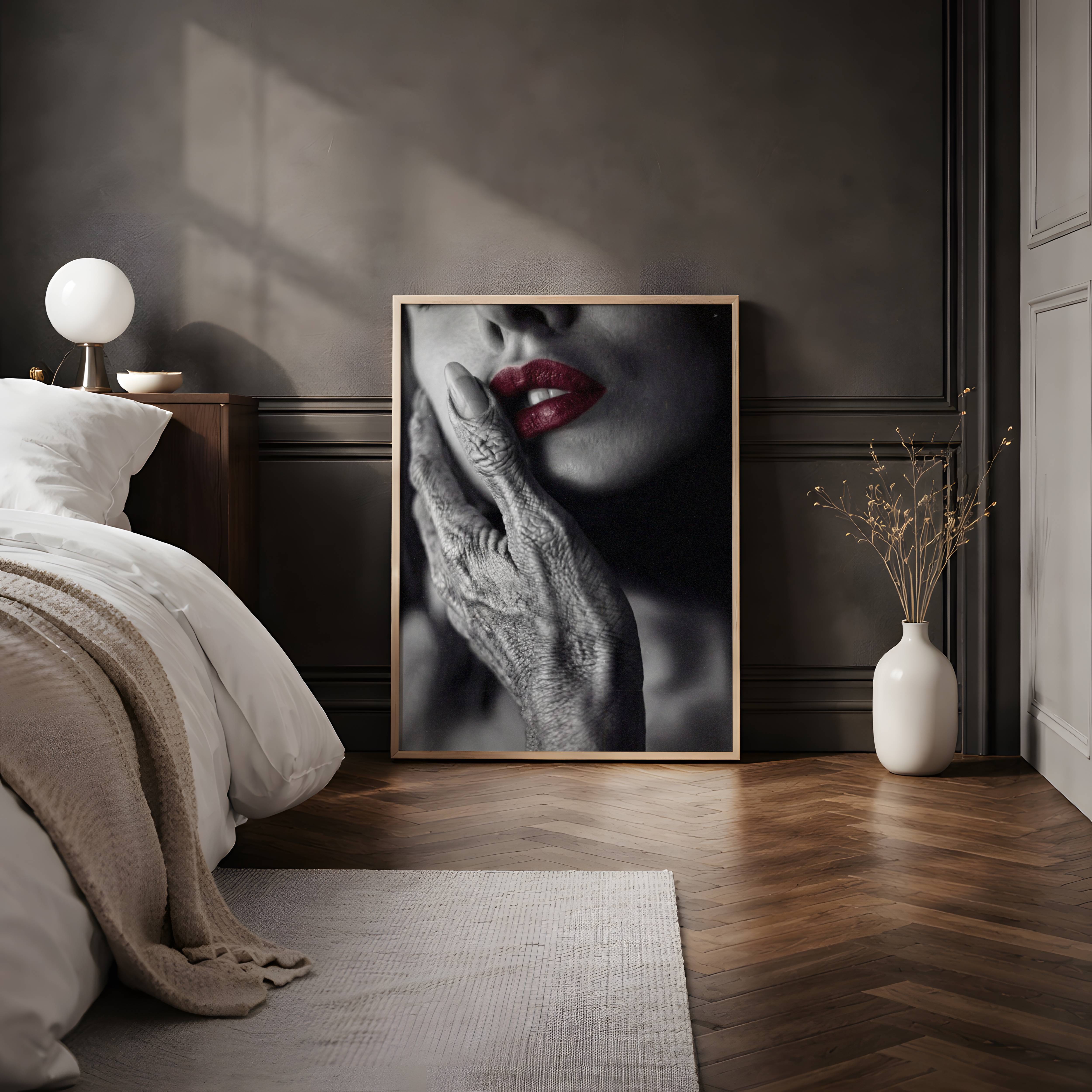 Moody dark monochrome close-up of a deeply textured grey alien finger against a woman's warm cheek, vivid red lips the single bold accent in an otherwise stark black and white composition — distinctive and sophisticated dark bedroom poster – unframed dark sci-fi art for bedroom, ufoposter.com