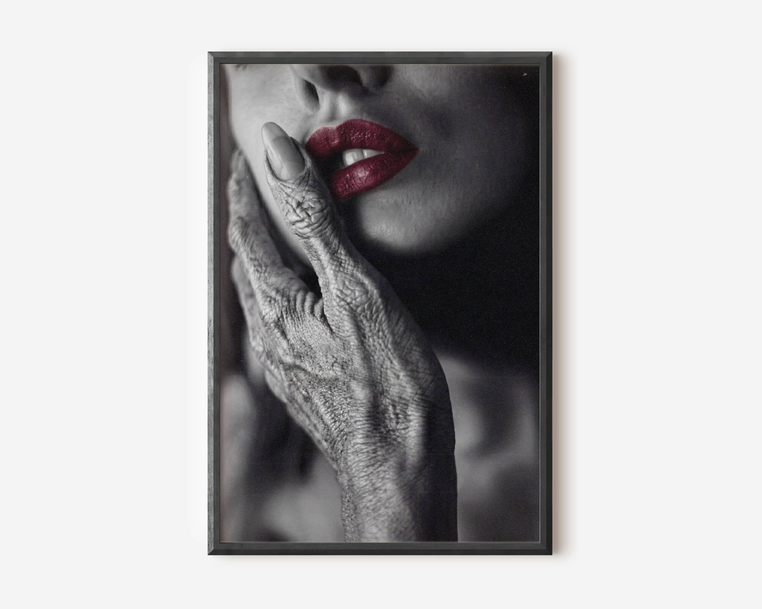 Premium dark monochrome close-up of a textured grey alien hand resting gently against a woman's cheek, her vivid red lips the only colour in an otherwise black and white composition — bold and sophisticated dark alien wall art – unframed dark alien art poster, ufoposter.com